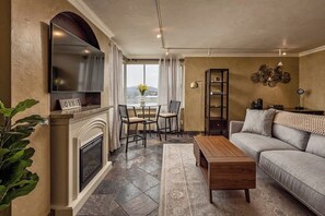 TV, fireplace, offices - Downtown Condo • Epic Views (Anchorage)