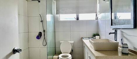Shower, towels, soap, toilet paper