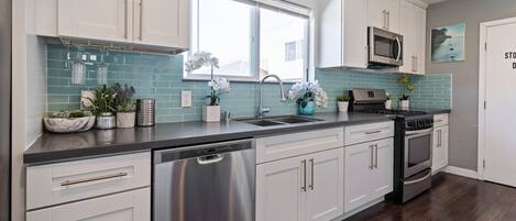 Fridge, microwave, dishwasher, cookware/dishes/utensils