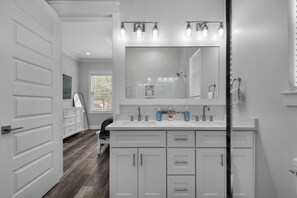 Shower, hair dryer, soap, toilet paper