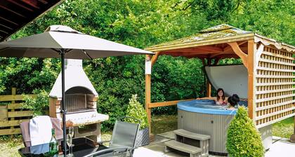 Open plan lodge with two doubles, both with TV/DVD.