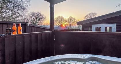 Open plan lodge with two doubles, both with TV/DVD.