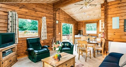 Open plan lodge with two doubles, both with TV/DVD.