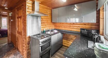Open plan lodge with two doubles, both with TV/DVD.