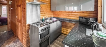 Open plan lodge with two doubles, both with TV/DVD.