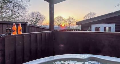 Open plan lodge with two doubles, both with TV/DVD.