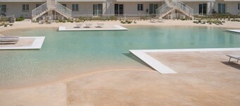 GuestHost - Charming 75 sqm seaview apartment on two levels, for 5 people, located inside the renowned Borgo 84 residence, equipped with swimming pool and cycle path. The property is located just 3 km from the center of Marzamemi, one of the most fascina