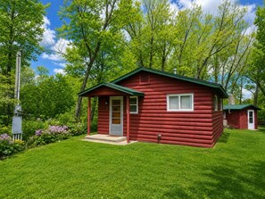 Exterior - Lovells Riverside Cabin #2 Enjoy the peaceful scenery at Lovells Riverside Cabin #2, featuring a private, screen-in back porch and lovely views of the forest and riverfront. (Grayling)