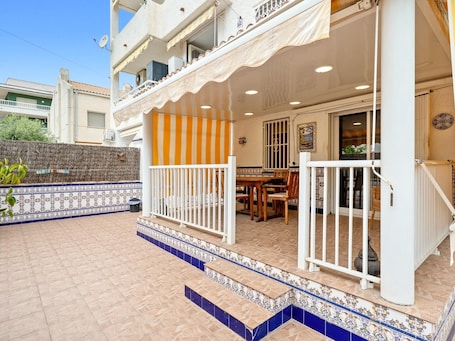 Outdoor dining. House with terrace and parking 150m beach