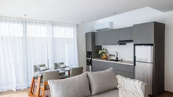 Deluxe Apartment, 2 Bedrooms | Living area | 43-inch Smart TV with digital channels