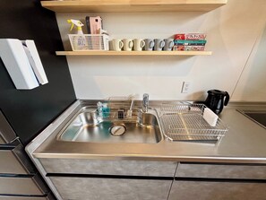 Fridge, microwave, stovetop, cookware/dishes/utensils