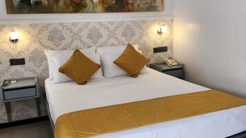 Premium bedding, down comforters, pillowtop beds, in-room safe