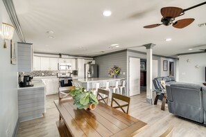 Enjoy a spacious open-plan living area with a kitchen, dining space, and comfortable seating.