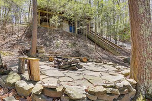 Stroll along the winding stone pathway to a secluded wooden staircase.