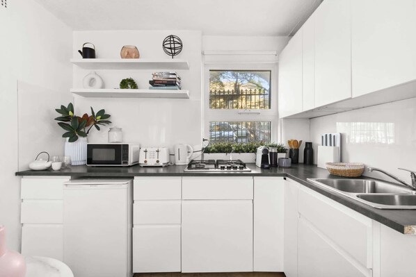 Microwave, stovetop, coffee/tea maker, toaster