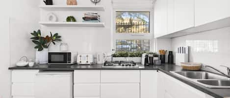 Microwave, stovetop, coffee/tea maker, toaster