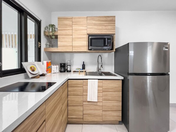 Fridge, microwave, stovetop, coffee/tea maker