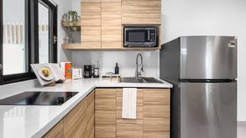 Fridge, microwave, stovetop, coffee/tea maker