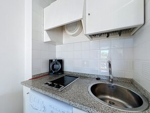 Fridge, microwave, coffee/tea maker, cookware/dishes/utensils