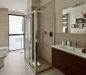 Shower, eco-friendly toiletries, hair dryer, bidet