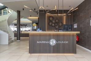 Welcome to the Marina Lounge, where a minimalist reception area offers a stylish and modern space.