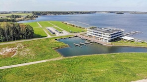 Enjoy stunning river views from this riverside hotel, featuring a dock for easy access and a well-manicured lawn.