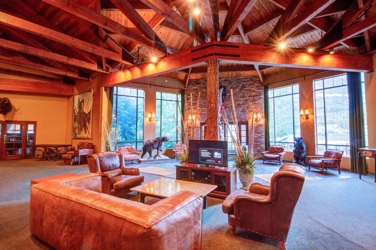 Unwind beneath soaring timber beams with mountain-view lounge seating.