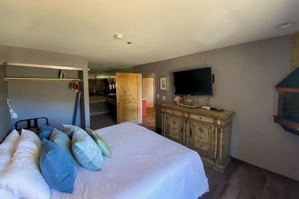 Stretch out on a king bed with TV-ready comfort.