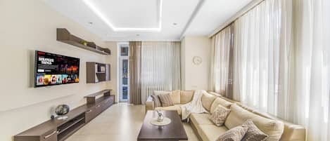 Exclusive Apartment, 3 Bedrooms, Non Smoking, Balcony | Living area | TV