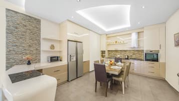 Exclusive Apartment, 3 Bedrooms, Non Smoking, Balcony | Private kitchen | Full-sized fridge, microwave, oven, stovetop