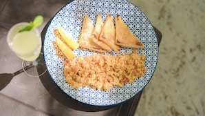 A plate with grilled sandwiches, a side of rice, and a glass of lemonade on a table. - Perla Negra House Hostel (Cartagena)