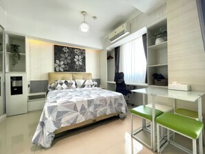 Deluxe Studio, Balcony, City View | Minibar, desk, laptop workspace, blackout curtains - Maple Park Apartment near JI Expo (Jakarta)