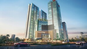 A modern hotel with multiple high-rise buildings, a prominent 'Holland Village' sign, and a well-maintained outdoor area with cars. - Staycation Jakarta Holland Village (Jakarta)