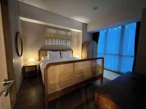 Deluxe Apartment, 3 Bedrooms, Balcony, City View | Minibar, desk, laptop workspace, blackout drapes