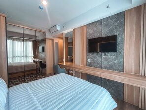 Deluxe Apartment, 2 Bedrooms, Balcony, City View | Minibar, desk, laptop workspace, blackout drapes