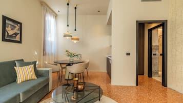 Deluxe Apartment, 1 King Bed with Sofa bed | Living area | 42-inch flat-screen TV with satellite channels