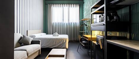 Superior Studio | Desk, laptop workspace, blackout drapes, soundproofing