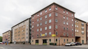 A multi-story building with 'Knoll Court' signage, featuring a brick facade and multiple windows. - Student Only Knoll Court (Newcastle-upon-Tyne)