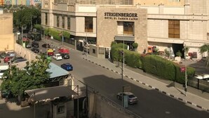 A large hotel with multiple floors and a prominent entrance. - marhaba inn (Cairo)