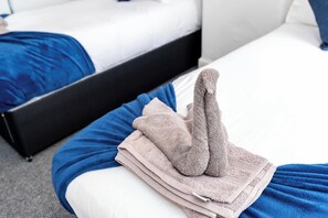 Relax in comfort with a neatly made bed and plush bedding.