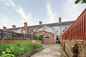 Stroll through the charming residential area surrounded by lush greenery and beautifully maintained homes with brick exteriors and pitched roofs.