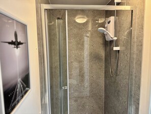 Shower, towels, soap, toilet paper