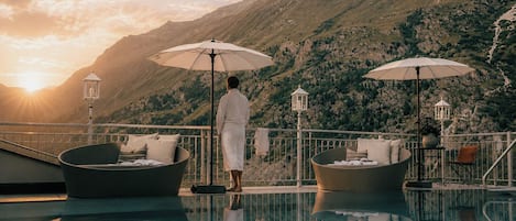 Indoor pool, outdoor pool, pool umbrellas, pool loungers