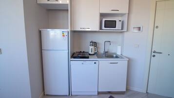 Microwave, dishwasher, dining tables