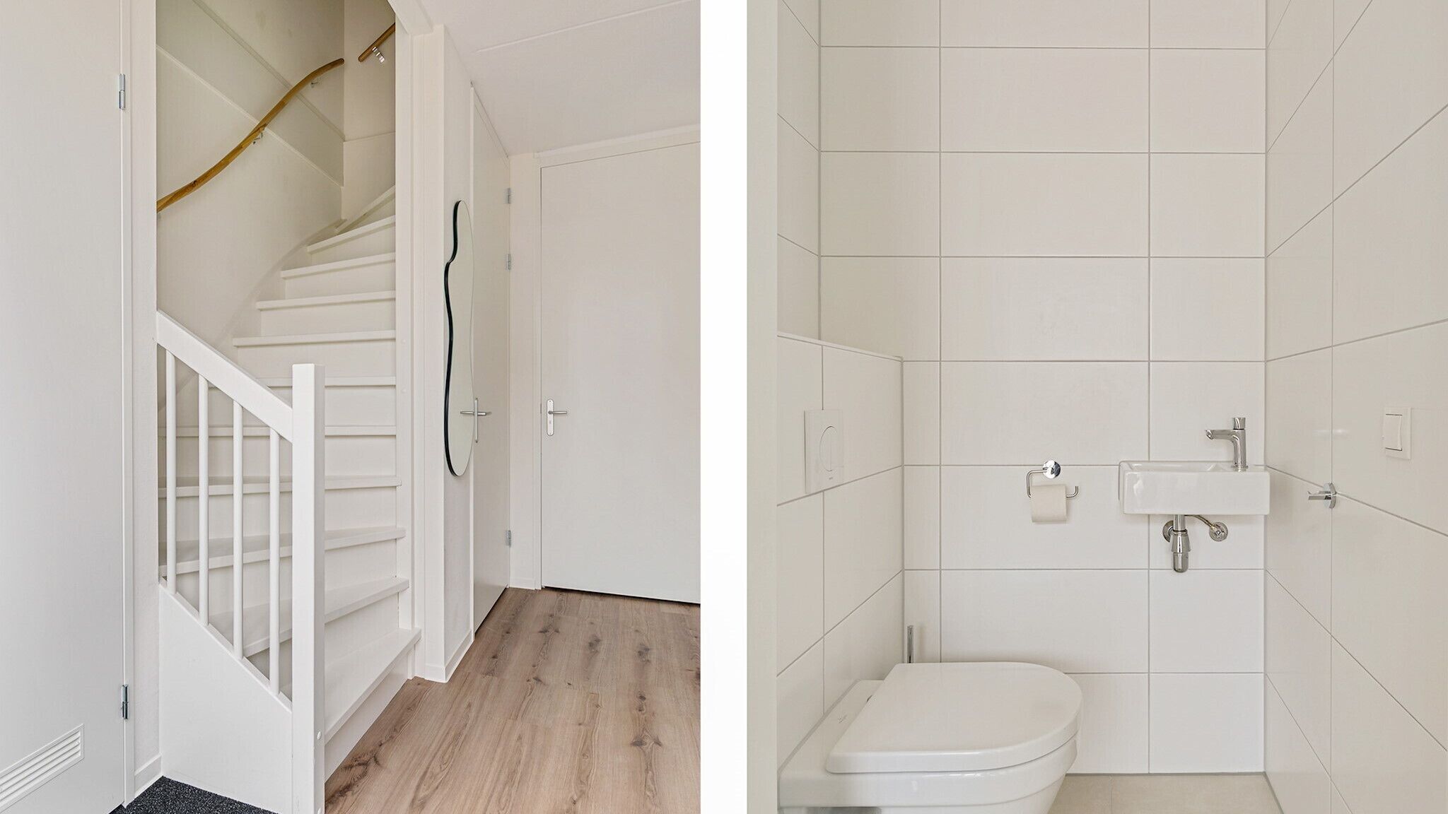 A staircase leading to a door, a white toilet, and a shower area with tiled walls.