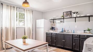 Fridge, coffee/tea maker, cookware/dishes/utensils