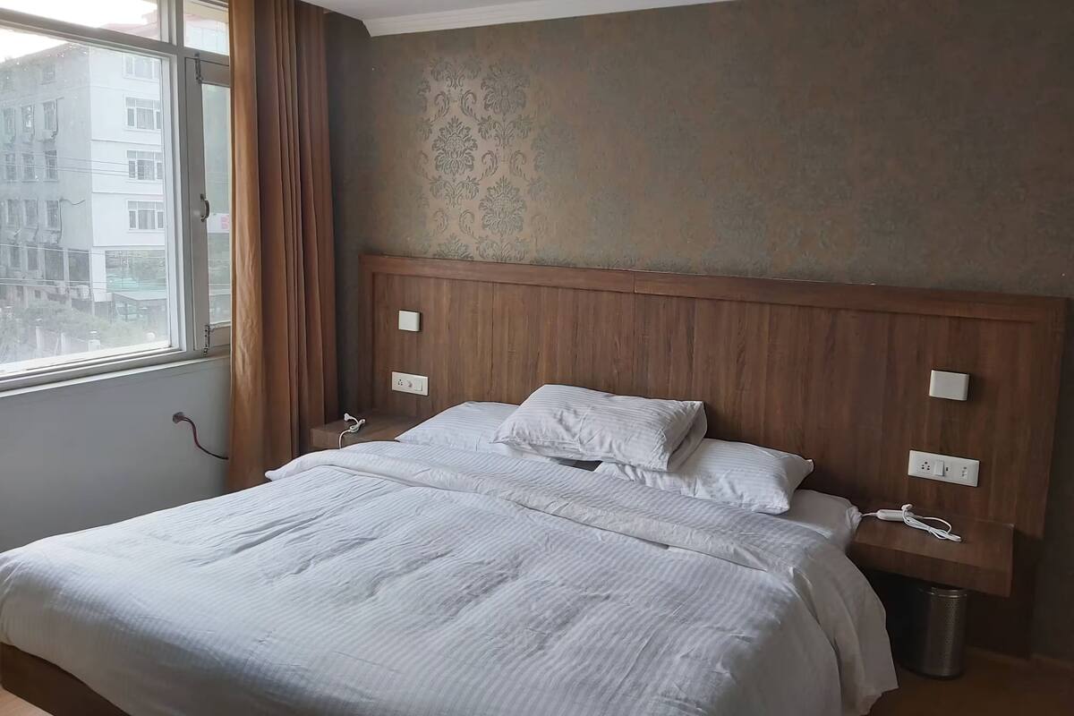 Habitación doble Deluxe, vista a la montaña | Área de sala de estar