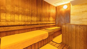 A sauna room with wooden walls and benches. - Yado Marubun (Minamiizu)