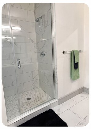 Shower, hair dryer, towels, soap