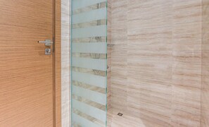 A wooden door with a glass panel and a metal handle. - Missoni-branded Residence Along Business Bay Canal (Dubai)